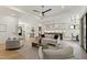 Bright, open-concept living space featuring a modern kitchen, dining area, and living room with hardwood floors at 5208 Knollwood Rd, Raleigh, NC 27609