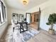 Bright office space featuring a modern desk, stylish rug, and elegant built-in shelving at 5208 Knollwood Rd, Raleigh, NC 27609