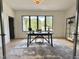 Bright office with a large window, desk, and view of the landscaped yard at 5208 Knollwood Rd, Raleigh, NC 27609