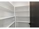 Well-organized pantry with ample shelving for storage, providing an efficient kitchen space at 5208 Knollwood Rd, Raleigh, NC 27609