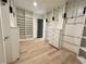 Large walk-in closet with adjustable shelving, drawers, and hanging rods providing optimal organization space at 5208 Knollwood Rd, Raleigh, NC 27609