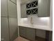 Stylish wet bar area with a wine rack, sink, and modern cabinetry at 5208 Knollwood Rd, Raleigh, NC 27609