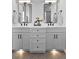 Dual vanity bathroom showcases modern mirrors, black fixtures, white countertops, and decorative tile floors at 55 Harvest View Way, Franklinton, NC 27525