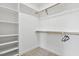 Walk-in closet with built-in shelving and carpeted floor at 55 Harvest View Way, Franklinton, NC 27525
