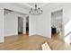 Dining room view showcases hardwood floors, stylish chandelier and open access to other rooms at 55 Harvest View Way, Franklinton, NC 27525