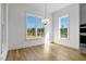 Bright dining room with hardwood floors and large windows at 55 Harvest View Way, Franklinton, NC 27525