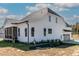 Bright white two-story home with a screened-in porch and an attached garage at 55 Harvest View Way, Franklinton, NC 27525