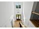 Grand foyer featuring a high ceiling, large windows, and modern chandelier for a bright and elegant entrance at 55 Harvest View Way, Franklinton, NC 27525