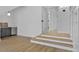 Staircase to hallway with glass door and bar area. Beautiful and bright space with lots of potential at 55 Harvest View Way, Franklinton, NC 27525