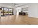 Bright living area with hardwood floors connecting to a kitchen, and balcony access at 55 Harvest View Way, Franklinton, NC 27525