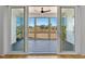 View of the screened-in porch with wood floors and ceiling fan at 55 Harvest View Way, Franklinton, NC 27525