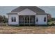 Rear exterior of home with screened in porch at 55 Harvest View Way, Franklinton, NC 27525