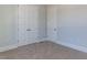 Bright bedroom with large window and double door closet at 6052 Scalybark Rd, Durham, NC 27712