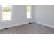 Inviting bedroom showcasing a large window with natural light at 6052 Scalybark Rd, Durham, NC 27712