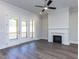 Cozy living room featuring a fireplace and access to an outdoor porch at 6052 Scalybark Rd, Durham, NC 27712