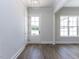 Bright living room with a fireplace and glass doors leading to an outdoor space at 6052 Scalybark Rd, Durham, NC 27712