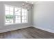 Comfortable living room with a fireplace and hardwood flooring, perfect for relaxation at 6052 Scalybark Rd, Durham, NC 27712