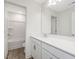 Bathroom featuring white cabinets, a sink, a mirror, and a view of a tub and toilet at 117 Shelby Meadow Ln, Angier, NC 27501