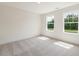 Bright bedroom with neutral carpet, and two windows letting in natural light at 117 Shelby Meadow Ln, Angier, NC 27501
