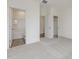Bright bedroom featuring an ensuite bathroom with tub-shower and a closet for ample storage at 117 Shelby Meadow Ln, Angier, NC 27501