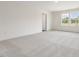 Spacious carpeted bedroom with ample natural light from the windows, ready for personalization at 117 Shelby Meadow Ln, Angier, NC 27501