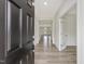 Inviting entryway featuring wood-look flooring, neutral walls, and view to dining area and study at 117 Shelby Meadow Ln, Angier, NC 27501