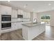 Modern kitchen featuring stainless appliances and a central island for cooking at 117 Shelby Meadow Ln, Angier, NC 27501