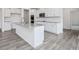 Kitchen island featuring granite countertops, stainless steel faucet, and undermount sink at 117 Shelby Meadow Ln, Angier, NC 27501