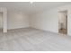 Open-concept living room with carpet flooring and neutral tones, creating a welcoming atmosphere at 117 Shelby Meadow Ln, Angier, NC 27501