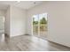 Living room with sliding glass doors leading to a backyard deck at 117 Shelby Meadow Ln, Angier, NC 27501
