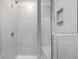 Modern shower with gray tile, built-in shelving, and a sleek glass enclosure at 117 Shelby Meadow Ln, Angier, NC 27501