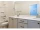 Bright bathroom features double vanity, and shower-tub combination at 6048 Scalybark Rd, Durham, NC 27712