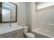 A clean bathroom with vanity, mirror, toilet and tub at 6048 Scalybark Rd, Durham, NC 27712