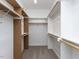 This spacious walk-in closet features custom shelving and racks, perfect for efficient organization and storage at 6048 Scalybark Rd, Durham, NC 27712