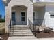 Stone steps lead to the front porch and front door of this beautiful home at 6048 Scalybark Rd, Durham, NC 27712