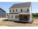 Two-story home featuring a screened-in porch and a light-colored siding at 6048 Scalybark Rd, Durham, NC 27712