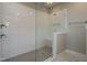 Large walk-in shower with white subway tile and a built-in bench at 6048 Scalybark Rd, Durham, NC 27712