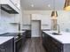 Eat-in kitchen area with natural light and modern oven at 6048 Scalybark Rd, Durham, NC 27712