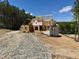 New home under construction with framing, sheathing, and roof trusses at 37 Green Turtle Ln, Pittsboro, NC 27312