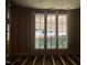 Interior unfinished room with exposed framing and large windows at 37 Green Turtle Ln, Pittsboro, NC 27312