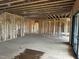 Open-concept living room and kitchen under construction with an arched doorway at 37 Green Turtle Ln, Pittsboro, NC 27312
