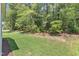 Lush backyard with a wooded area and green grass at 9140 Dupree Meadow Dr # 9, Angier, NC 27501