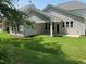Covered patio and grassy lawn in this backyard at 9140 Dupree Meadow Dr # 9, Angier, NC 27501