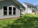 Back of home with a covered patio and green lawn at 9140 Dupree Meadow Dr # 9, Angier, NC 27501