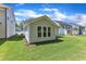 Backyard featuring vinyl siding and manicured green grass at 9140 Dupree Meadow Dr # 9, Angier, NC 27501
