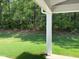 Green backyard featuring sunlight and forest, perfect for outdoor enjoyment and relaxation at 9140 Dupree Meadow Dr # 9, Angier, NC 27501