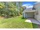 Spacious backyard with lush green lawn and a covered patio, perfect for outdoor entertaining at 9140 Dupree Meadow Dr # 9, Angier, NC 27501