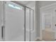 Modern bathroom featuring a glass-enclosed shower with white tile and a built-in seat at 9140 Dupree Meadow Dr # 9, Angier, NC 27501