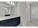 Primary bathroom with large vanity, framed mirrors, and a modern glass shower at 9140 Dupree Meadow Dr # 9, Angier, NC 27501