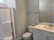 Well-lit bathroom with a shower, toilet, and a vanity, and modern fixtures at 9140 Dupree Meadow Dr # 9, Angier, NC 27501